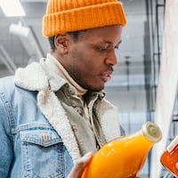 man exhibiting buyer behavior at grocery store (thumbnail)